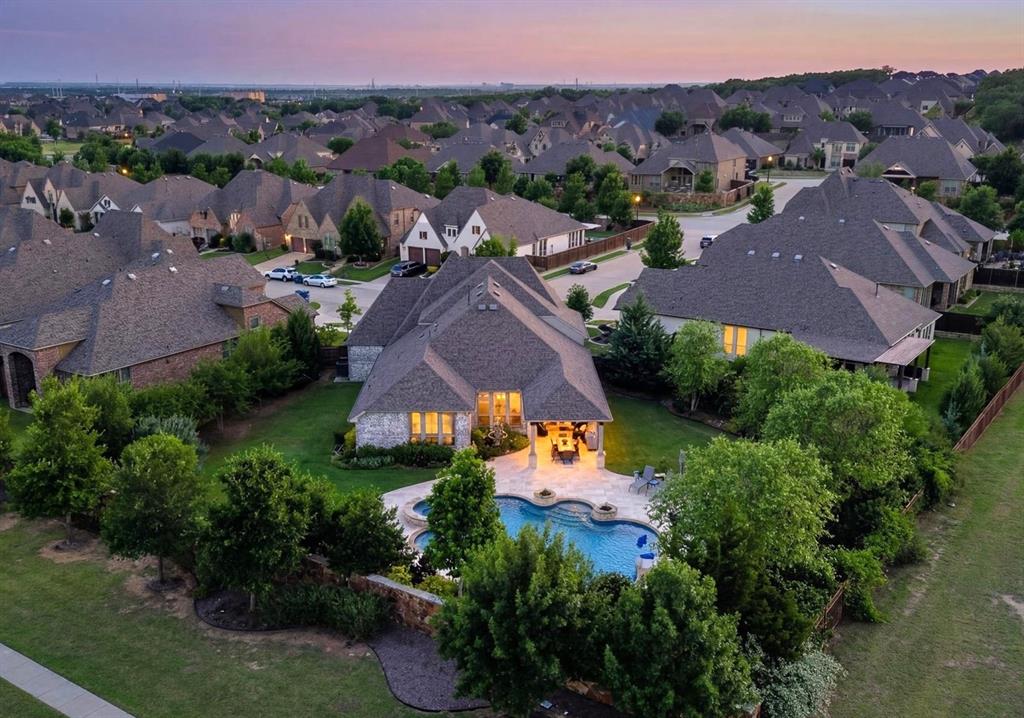 6656 Roughleaf Ridge Road Flower Mound, TX 76226 - Photo 3 of 40 an aerial view of a house with a garden