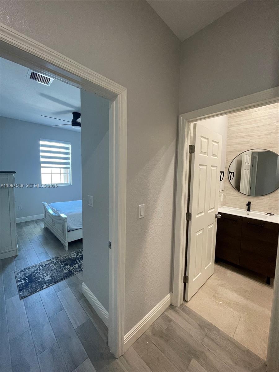 8900 Southwest 226th Terrace Cutler Bay, FL 33190 - Photo 17 of 40 a view of living room and front door