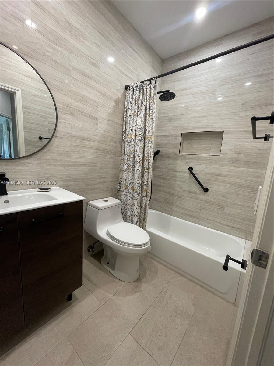 8900 Southwest 226th Terrace Cutler Bay, FL 33190 - Photo 19 of 40 a bathroom with a sink a toilet and shower