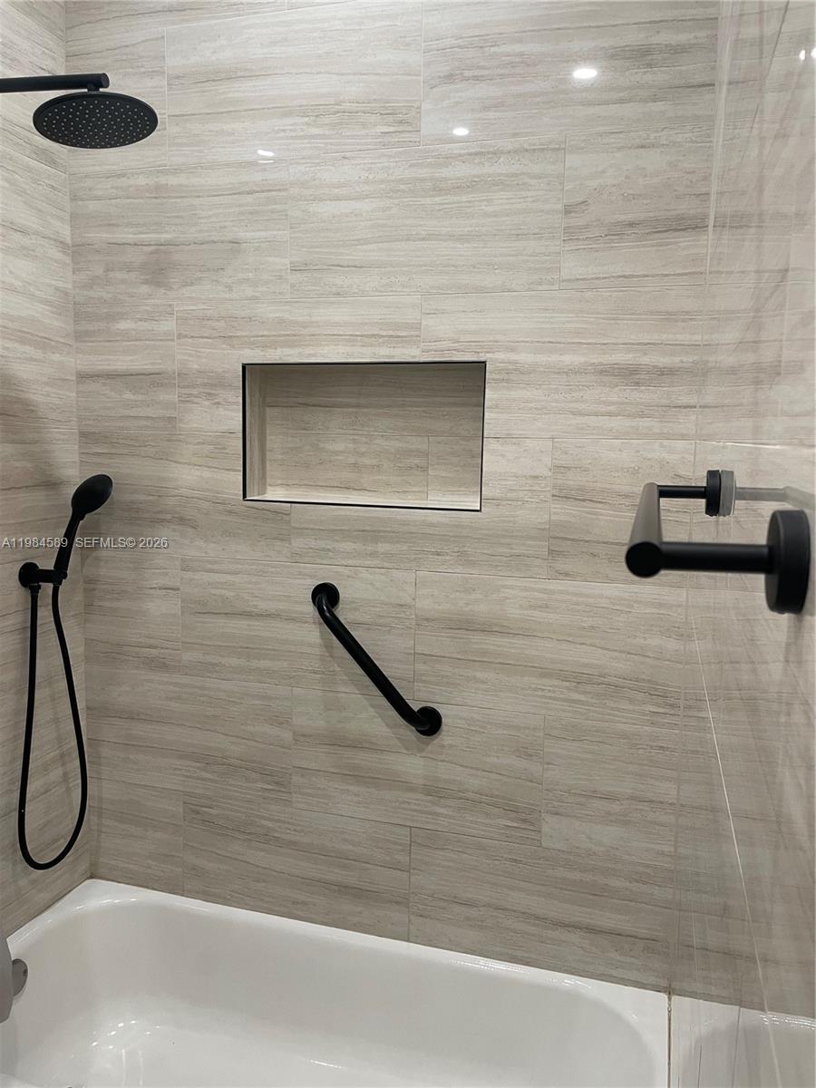 8900 Southwest 226th Terrace Cutler Bay, FL 33190 - Photo 21 of 40 a bathroom with a shower