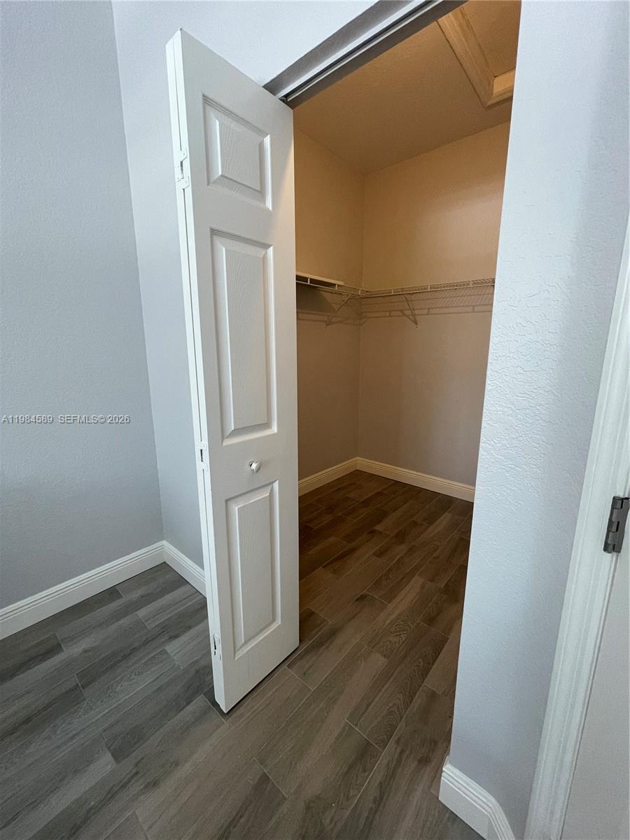 8900 Southwest 226th Terrace Cutler Bay, FL 33190 - Photo 28 of 40 an empty room with wooden floor