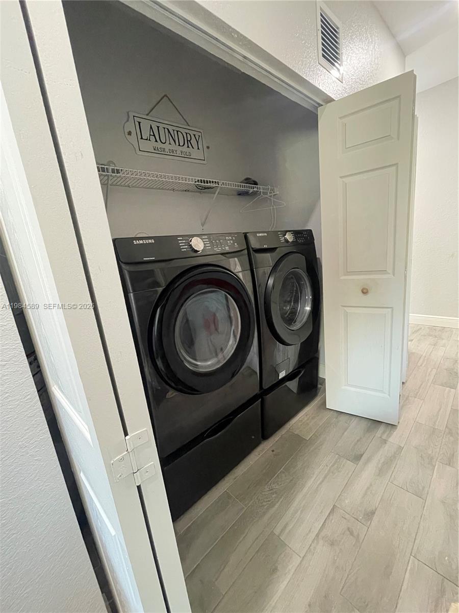8900 Southwest 226th Terrace Cutler Bay, FL 33190 - Photo 30 of 40 a utility room with dryer and washer