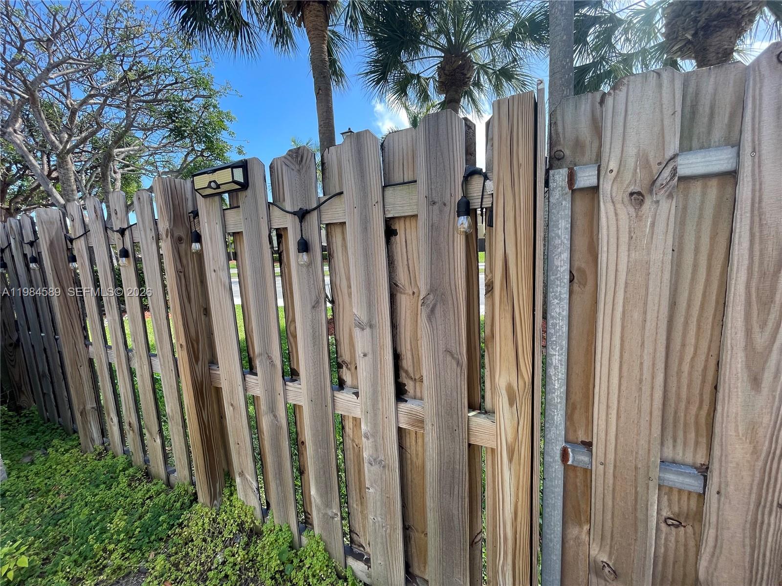 8900 Southwest 226th Terrace Cutler Bay, FL 33190 - Photo 36 of 40 a view of a backyard with white fence