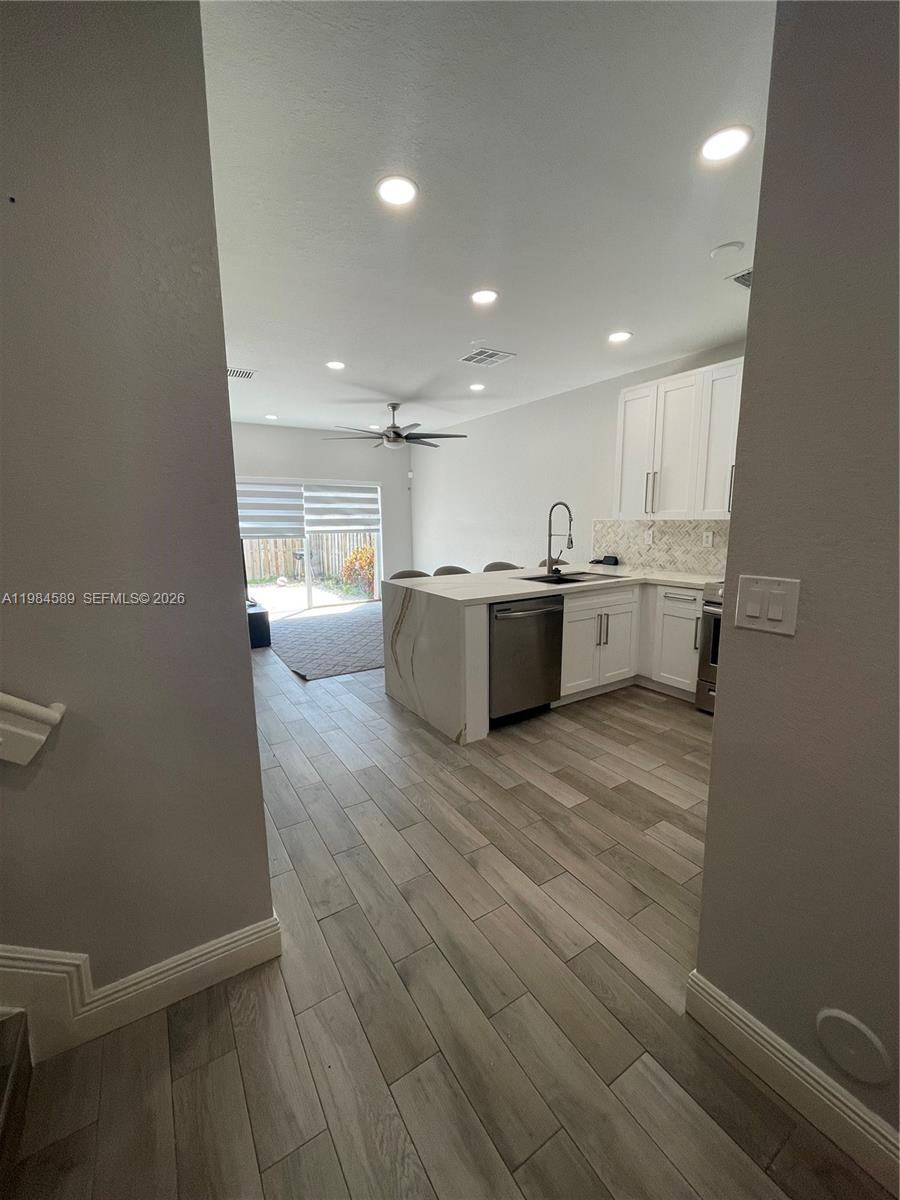 8900 Southwest 226th Terrace Cutler Bay, FL 33190 - Photo 4 of 40 a view of kitchen and wooden floor