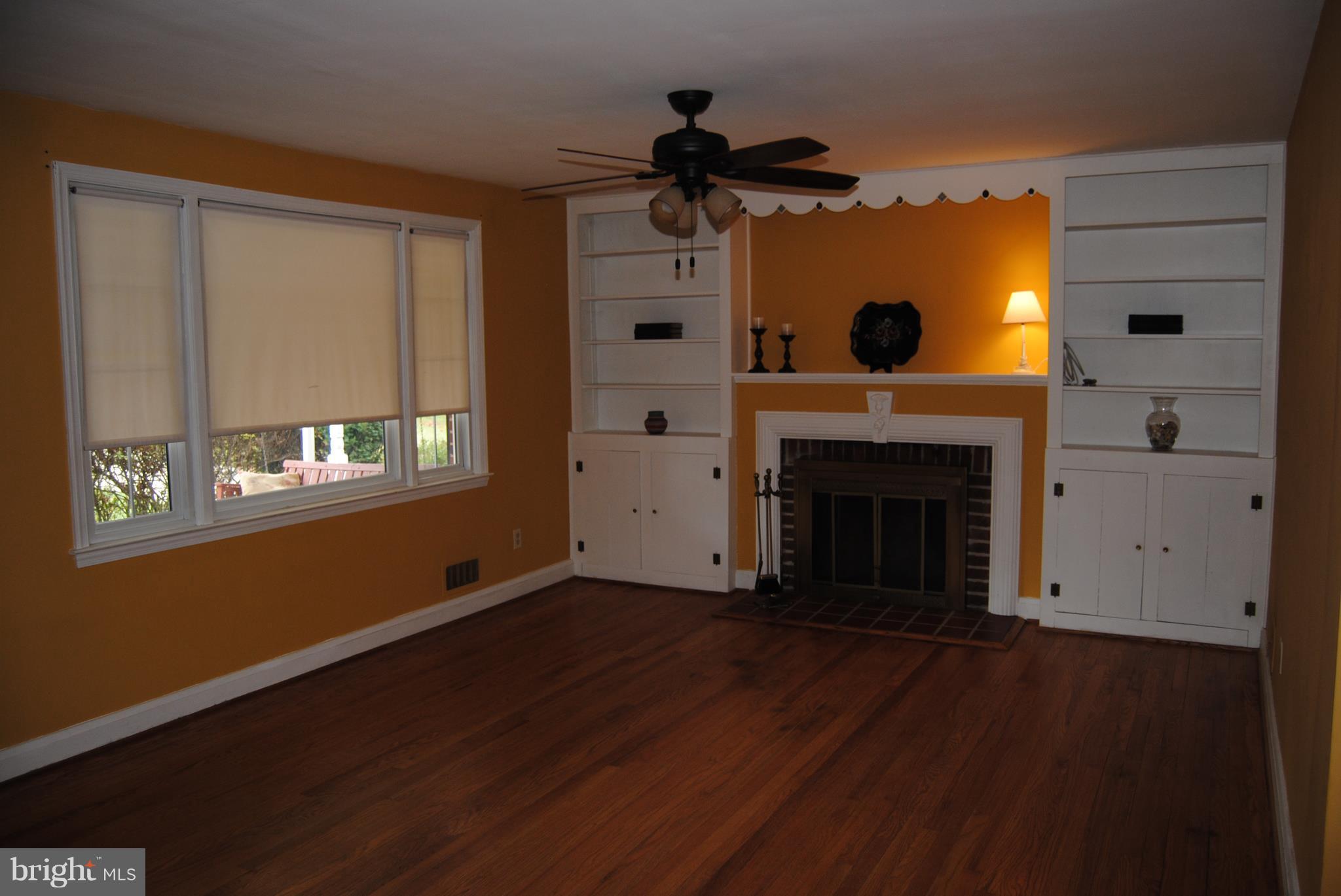 319 Waveland Road Baltimore, MD 21228 - Photo 2 of 21 Living Room w/ hardwoods and fireplace