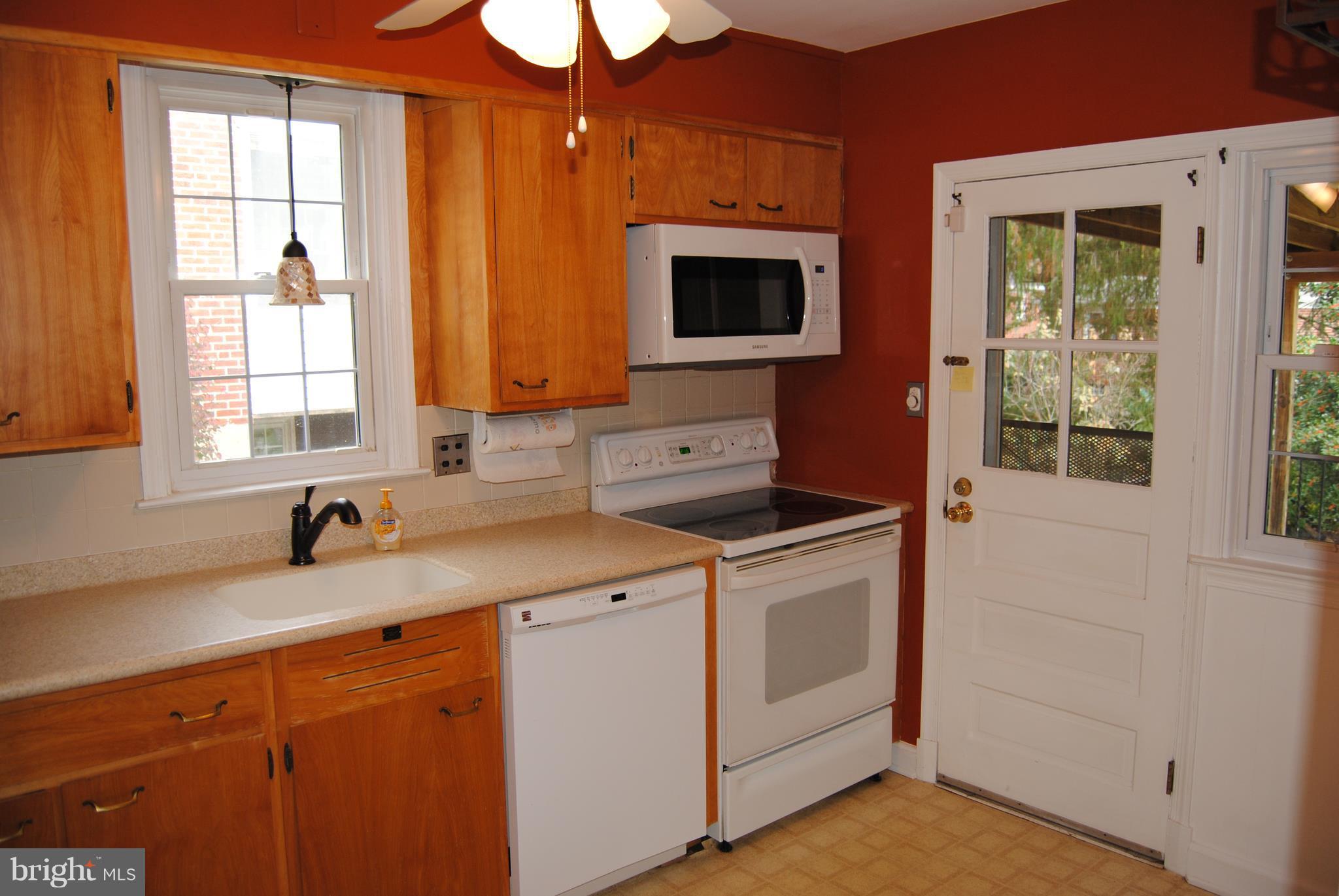 319 Waveland Road Baltimore, MD 21228 - Photo 6 of 21 Bright Kitchen w/ access to porch