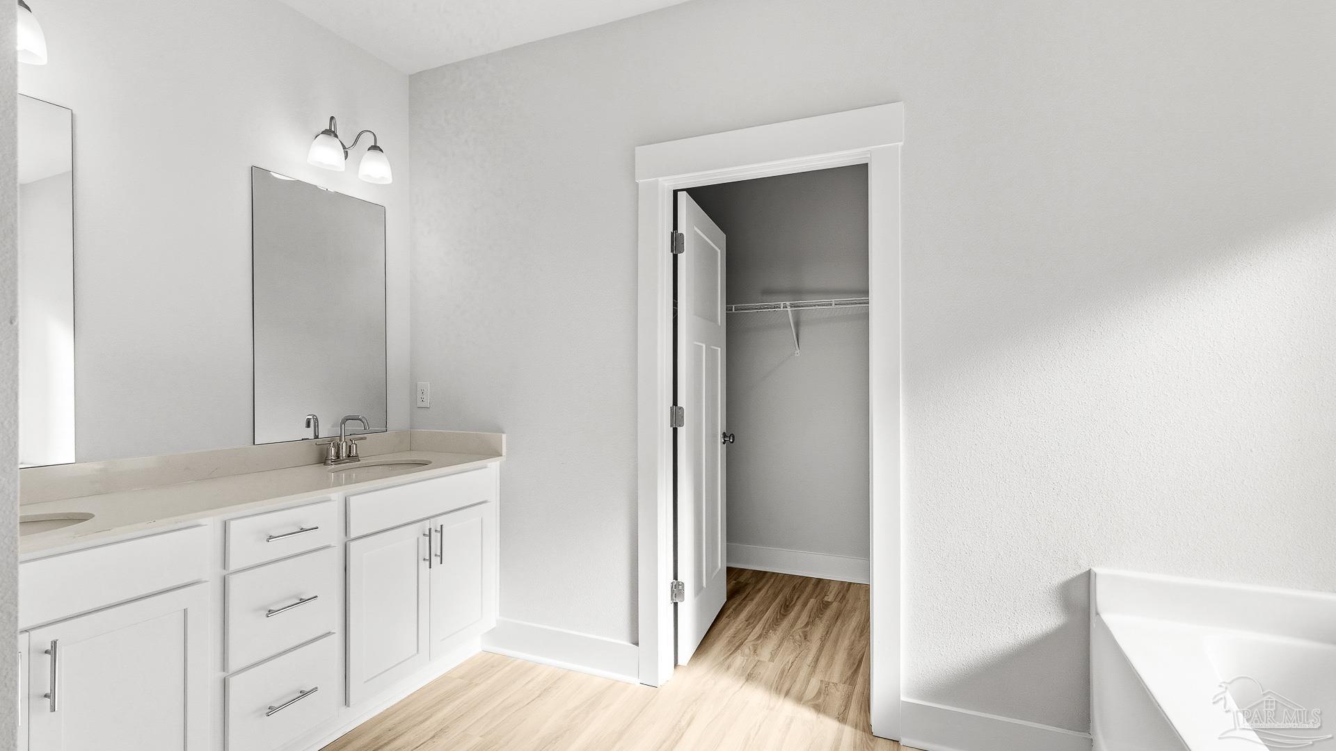 136 Albatross Street Cantonment, FL 32533 - Photo 18 of 43 a en suite bathroom with a sink a mirror and a shower