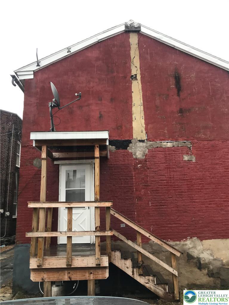 44 Mauch Chunk Street, Unit 7 Tamaqua, PA 18252 - Photo 2 of 8 a front view of a house with a yard