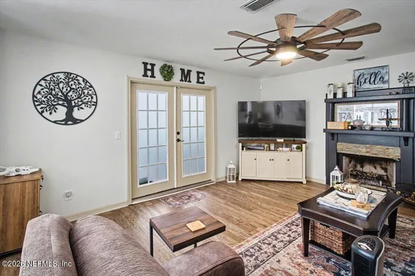 a living room with furniture and a flat screen tv