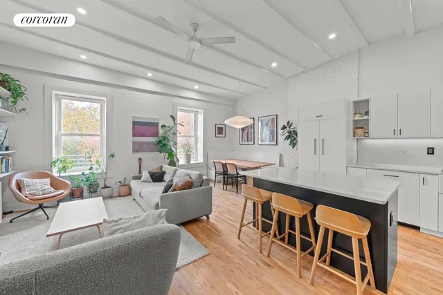 a living room with furniture and a table