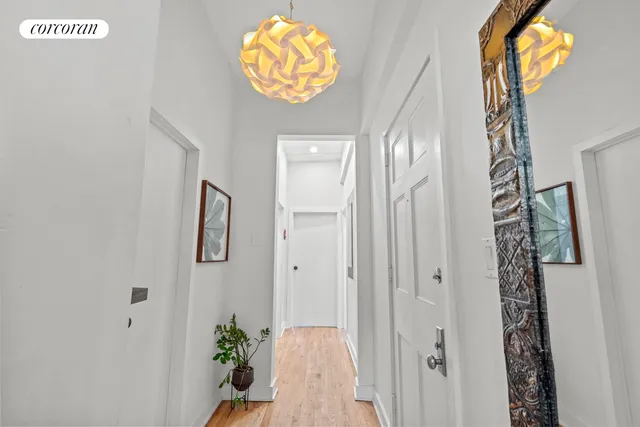 a view of a hallway to a window