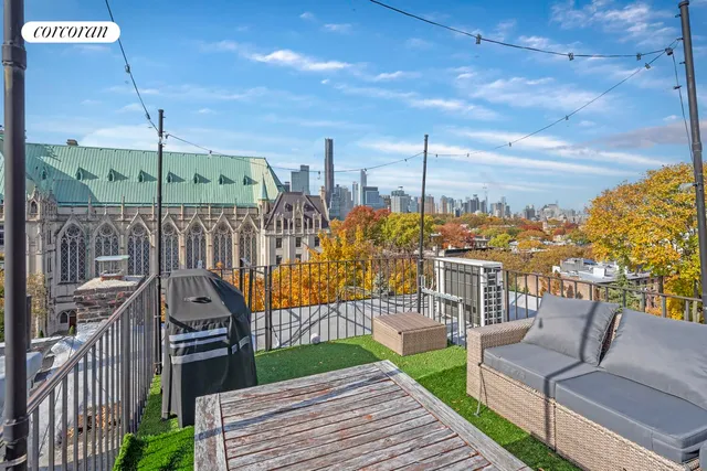 a view of a roof deck with couches