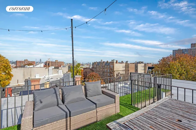 a view of a balcony with furniture