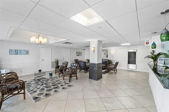 a view of a patio with a table and chairs under an umbrella