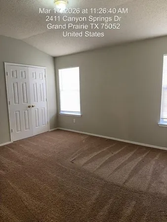 an empty room with a empty space and windows