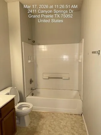 a bathroom with a bathtub and a sink