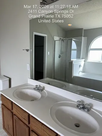 a bathroom with a bathtub and a shower
