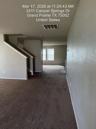 a view of empty room with windows