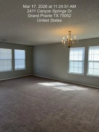 a view of empty room with a fireplace