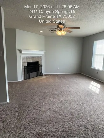 a kitchen with kitchen island a sink a stove a microwave a counter top and a dining table