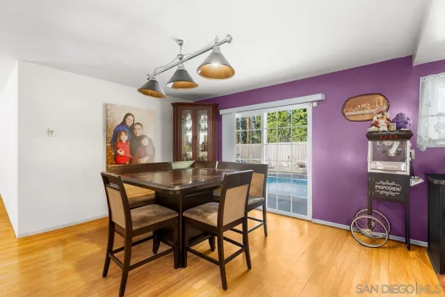 a view of a dining room with furniture and window