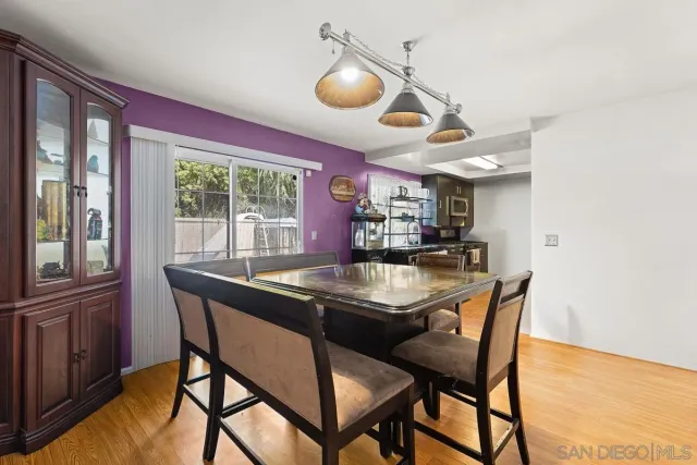 a kitchen with a table and chairs in it