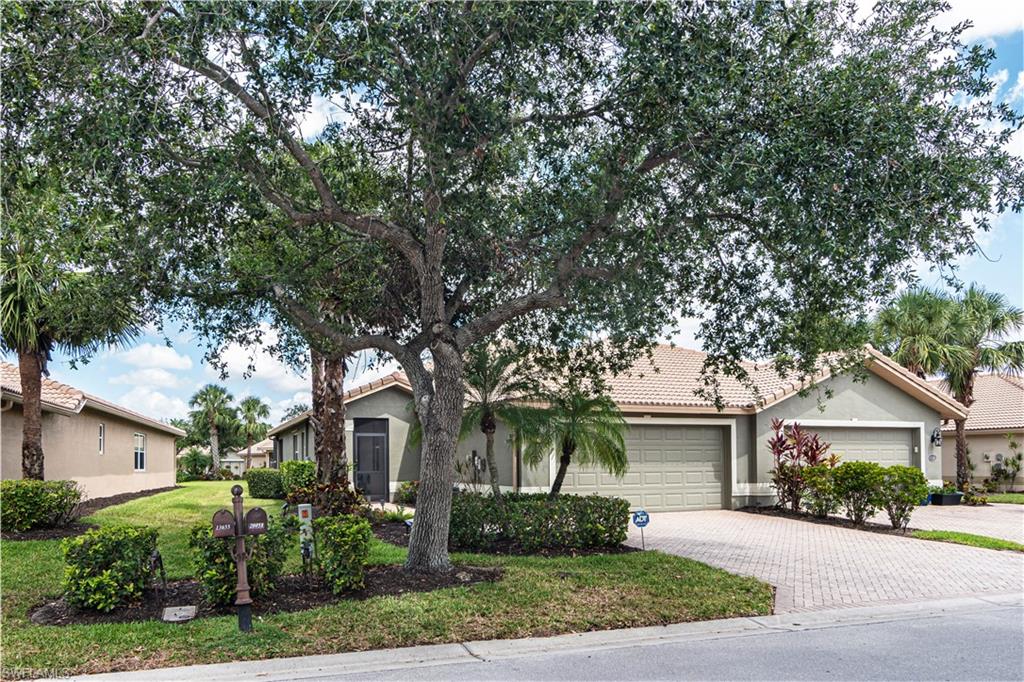 20058 Serre Drive Estero, FL 33928 - Photo 1 of 22 front view of a house with a street