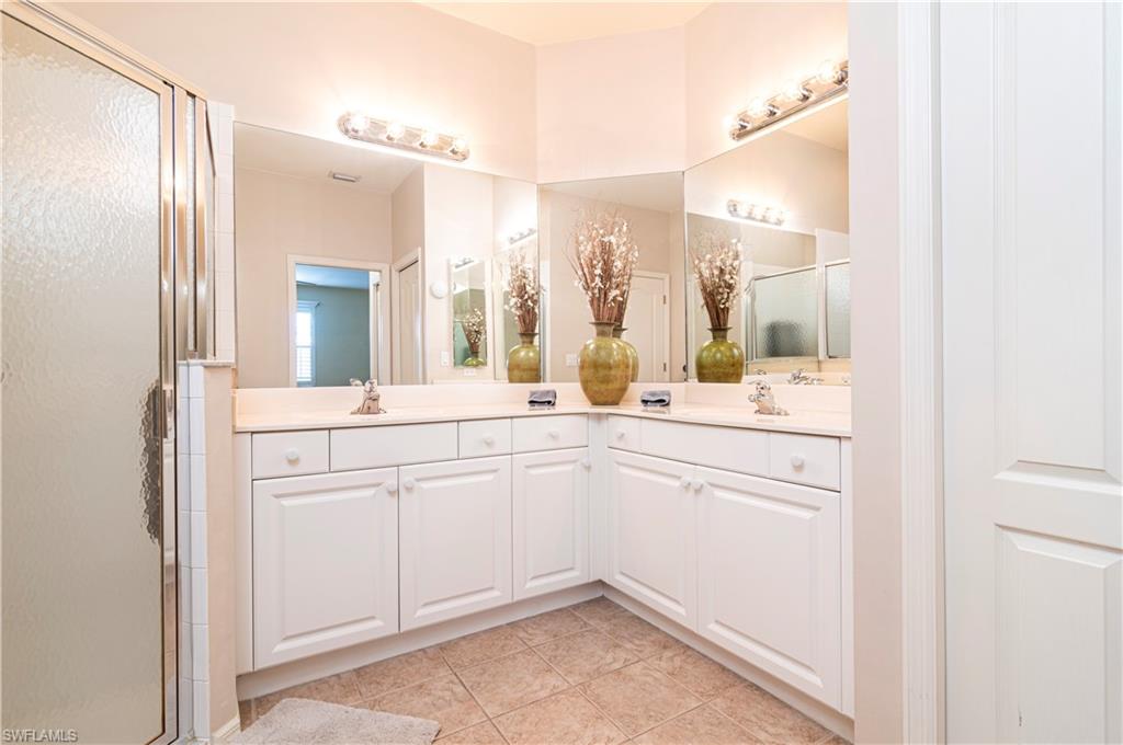 20058 Serre Drive Estero, FL 33928 - Photo 13 of 22 a bathroom with a sink and a mirror