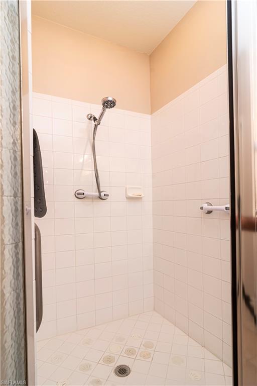 20058 Serre Drive Estero, FL 33928 - Photo 14 of 22 a bathroom with a shower