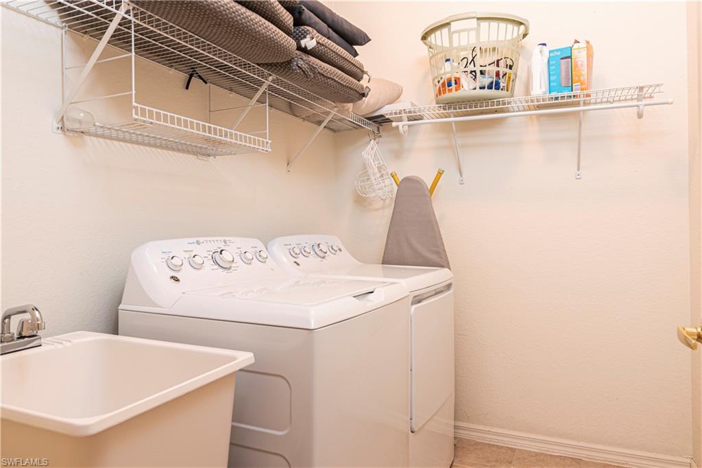 20058 Serre Drive Estero, FL 33928 - Photo 17 of 22 a utility room with dryer and washer