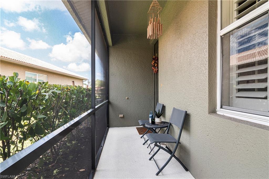 20058 Serre Drive Estero, FL 33928 - Photo 2 of 22 a view of a balcony with chair and outside view