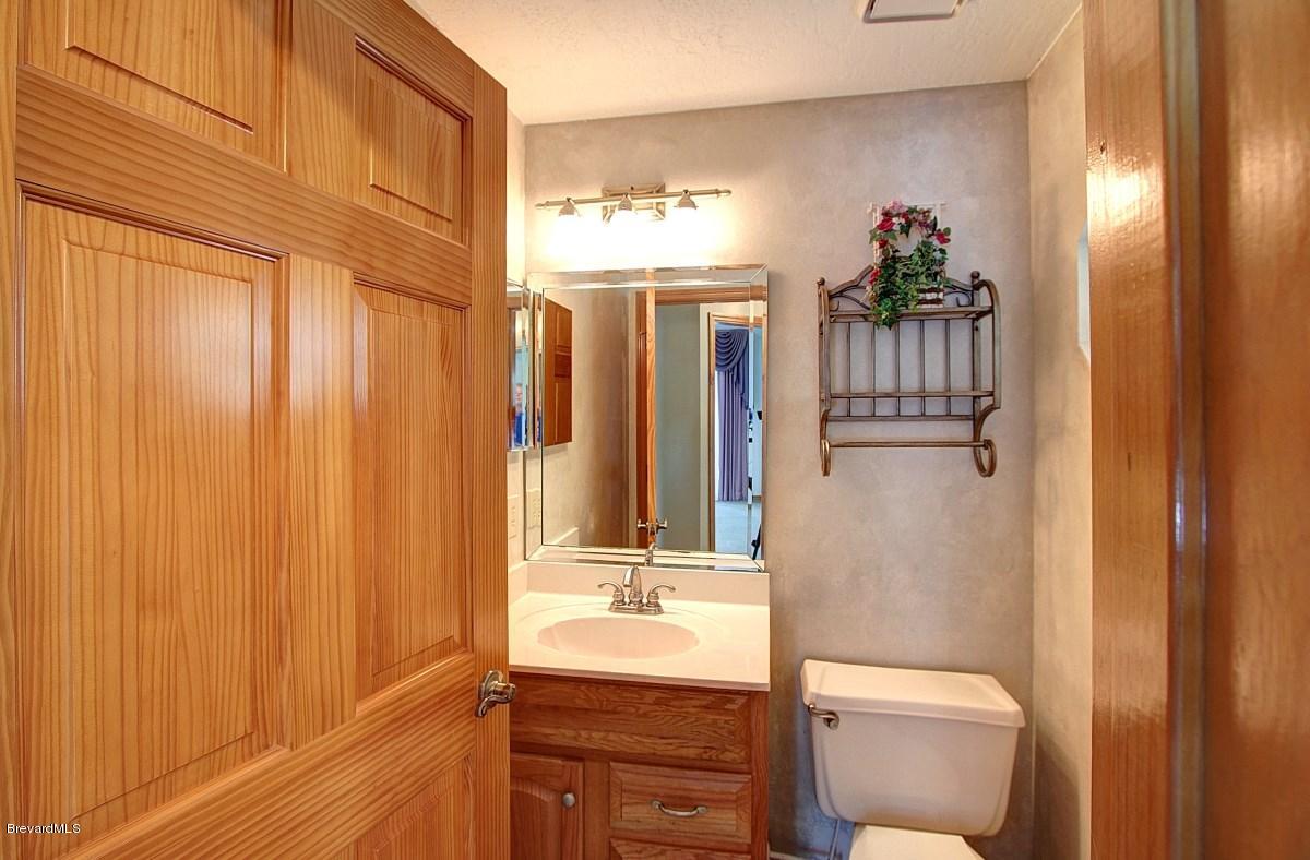 3405 Holly Springs Road Melbourne, FL 32934 - Photo 14 of 18 half bath