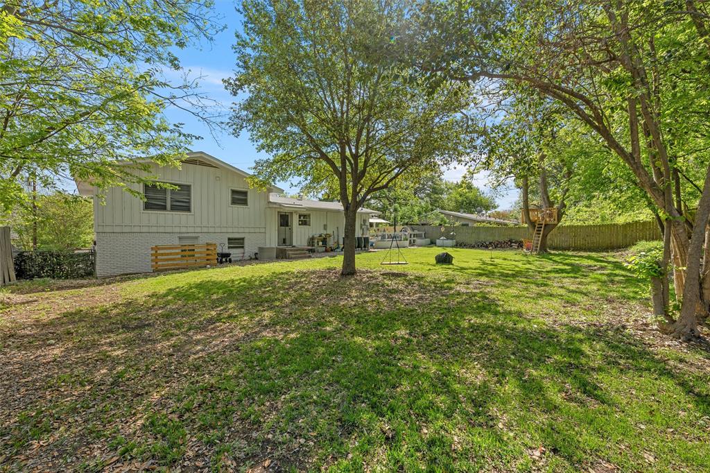 2216 Hermanson Drive Waco, TX 76710 - Photo 32 of 39 a view of a yard with plants and large trees