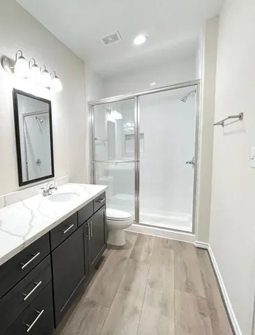 a bathroom with a granite countertop sink mirror and double