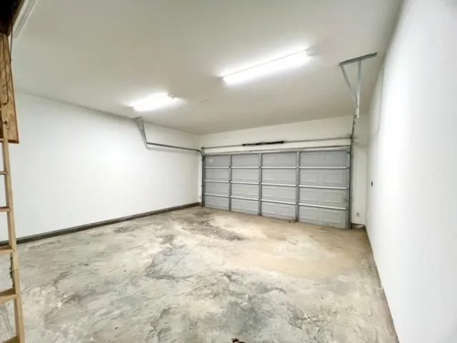 an empty room with white walls