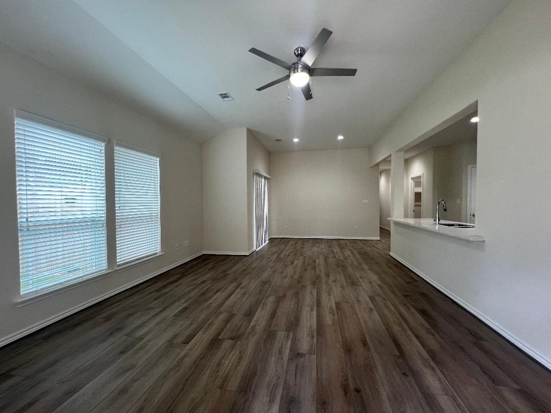 851 A Arbor Pnes Court Conroe, TX 77303 - Photo 13 of 13 a view of an empty room with wooden floor and a window