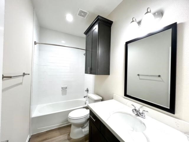 851 A Arbor Pnes Court Conroe, TX 77303 - Photo 5 of 13 a bathroom with a bathtub shower sink mirror and toilet