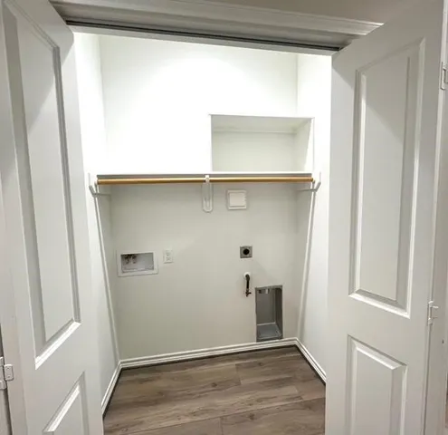 a bathroom with a bathtub shower sink mirror and toilet