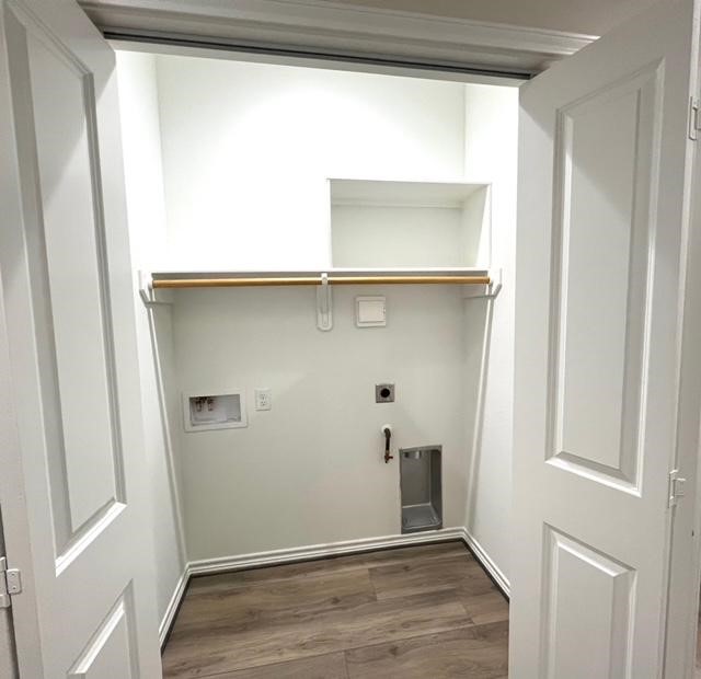 851 A Arbor Pnes Court Conroe, TX 77303 - Photo 6 of 13 a view of an empty room with wooden floor and a window