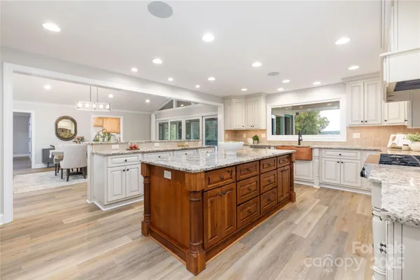 a kitchen with counter top space cabinets and appliances