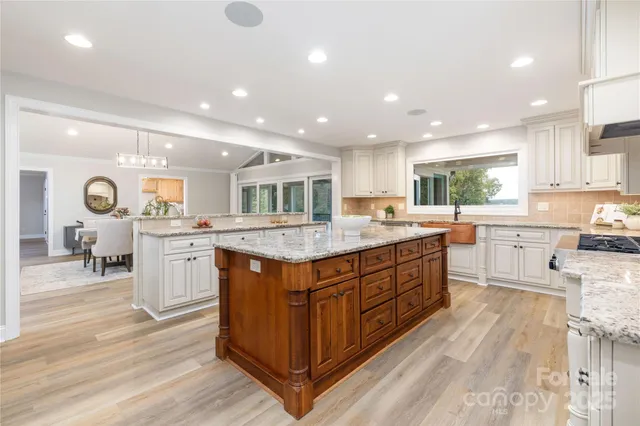 a kitchen with counter top space cabinets and appliances
