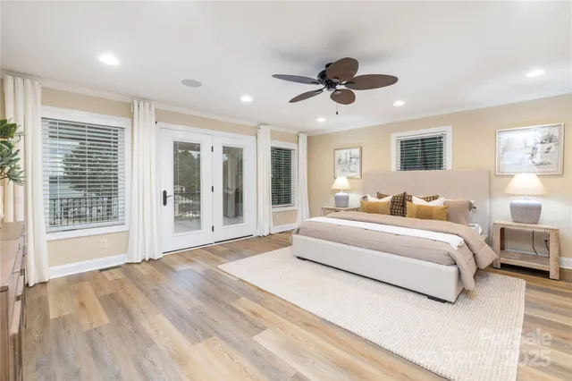 a spacious bedroom with a large bed and a large window