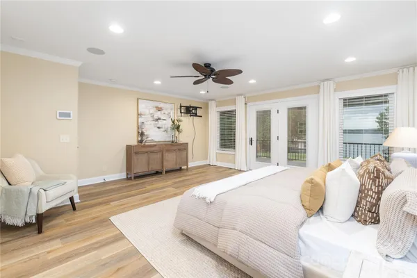 a spacious bedroom with a bed and ceiling fan