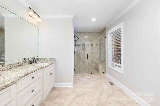 a bathroom with a granite countertop sink mirror and a