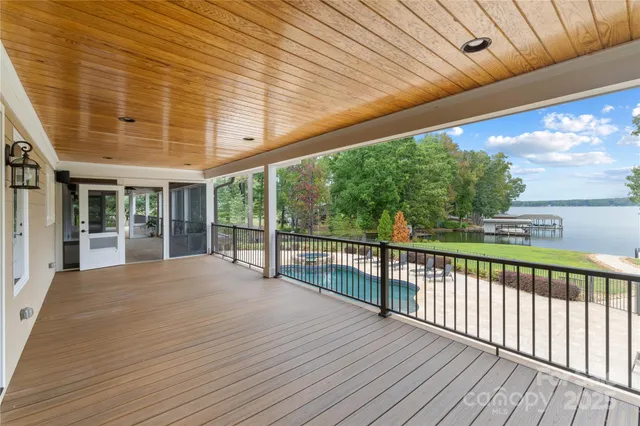 a view of balcony with wooden floor