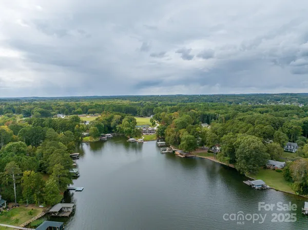 an aerial view of a city with lake view