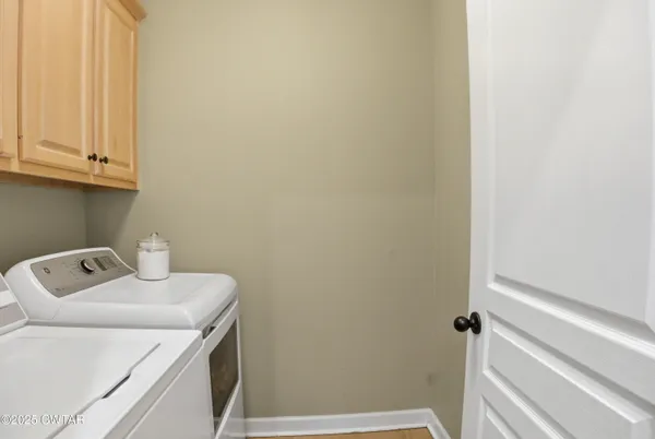 a bathroom with a sink and cabinets