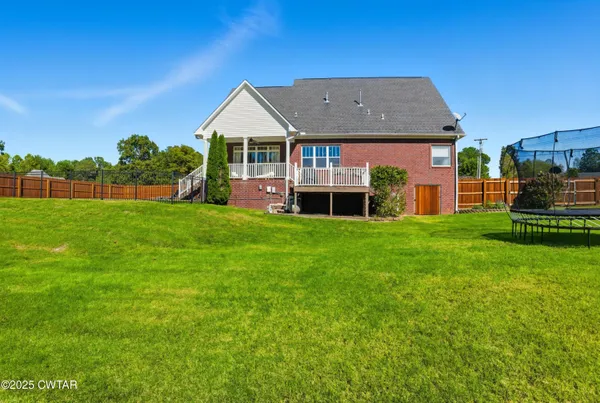a view of a house with a back yard