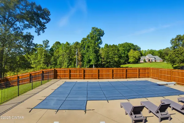 a view of swimming pool with seating space