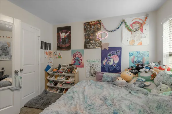 a bedroom with furniture and a bed